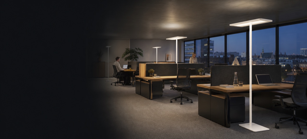Modern open workplace with white office floor lamps